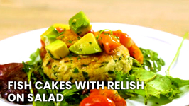 Fish Cakes With Avocado And Roasted Tomato Relish On Arugula Salad
